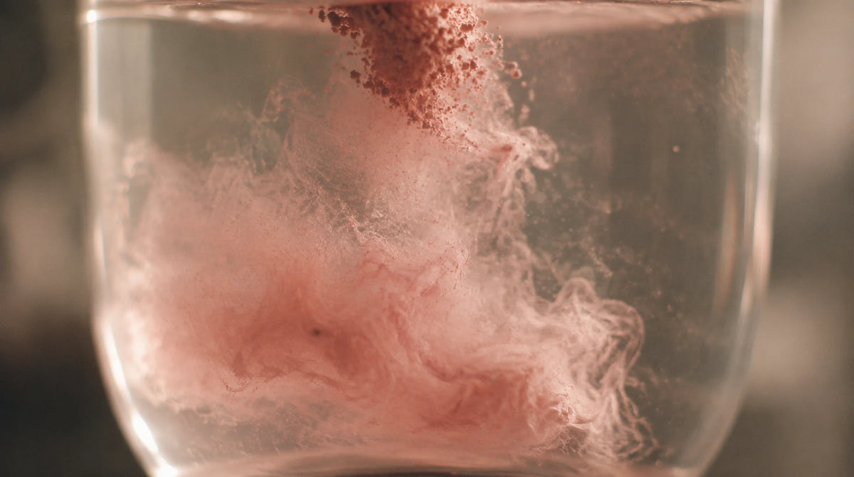 Protocol 32 powder dispersing in a glass of water